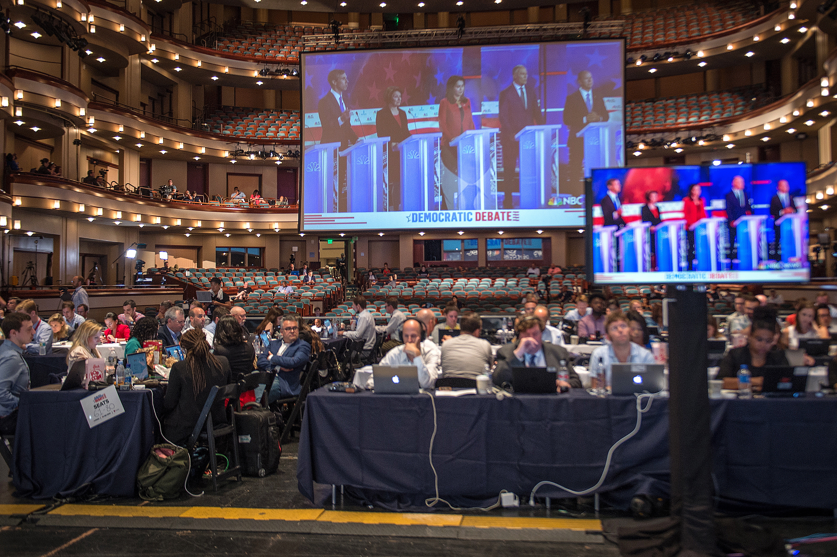 epa07676101 Members of the media view the televised debate of the Presidential Candidates in the Democratic Party, which took place in the Adrienne Arsht Center of the Performing Arts, in Miami, Florida, USA, 26 June 2019.  EPA/GIORGIO VIERA