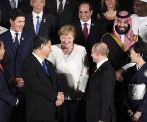 epa07680031 Chinese President Xi Jingping (C-L), German Chancellor Angela Merkel (C) and Russian President Vladimir Putin (C-R) pose for the official family picture during a cultural event at the Osaka Geihinkan during the G20 summit in Osaka, Japan, 28 June 2019. The leaders of the world's largest economies gathered in Osaka for the fourteenth meeting of Group of Twenty (G20).  EPA/LUKAS COCH  AUSTRALIA AND NEW ZEALAND OUT