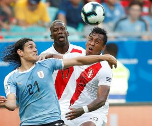 epa07683597 Uruguay's Edinson Cavani (L) in action against Peruvian Renato Tapia (R) during the Copa America 2019 quarter-finals soccer match between Uruguay and Peru, at Arena Fonte Nova Stadium in Salvador, Brazil, 29 June 2019.  EPA/Joedson Alves