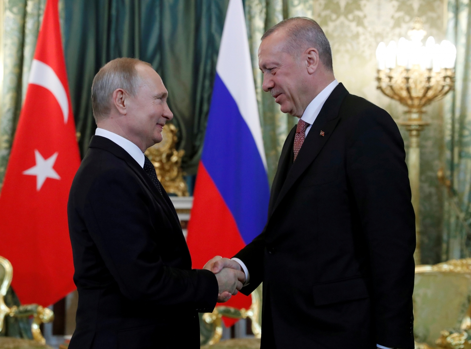 FILE PHOTO: Russian President Vladimir Putin and Turkish President Tayyip Erdogan meet in Moscow FILE PHOTO: Russian President Vladimir Putin shakes hands with Turkish President Tayyip Erdogan during their meeting in the Kremlin in Moscow, Russia, April 8, 2019. Maxim Shipenkov/Pool via REUTERS/File Photo POOL New