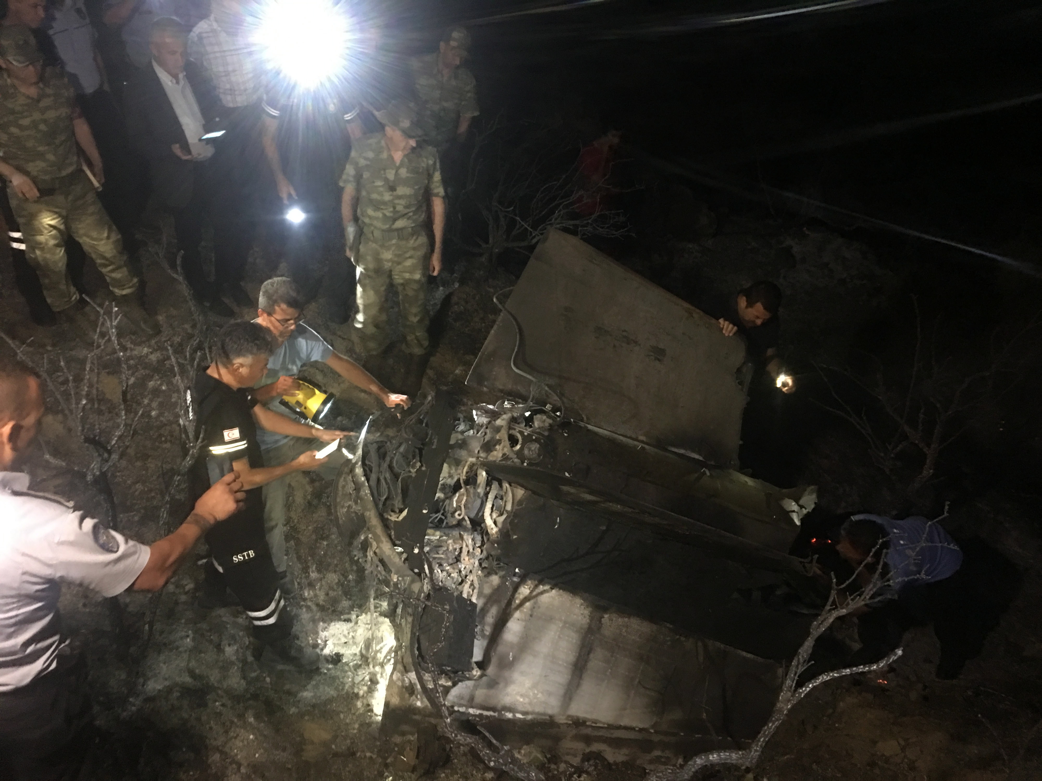 epa07686939 Soldiers of the Turkish army and northern Cypriot forces inspect the site where a missile allegedly fired from Syria landed overnight in the Turkish occupied north village of Tashkent (also known as Vouno), Cyprus, 01 July 2019. According to media reports, a Syrian anti-aircraft missile that missed its target landed in North Cyprus. No causalities reported in the incident. The missile is believed to have been launched to intercept alleged Israeli airstrikes.  EPA/STRINGER