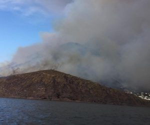 epa07693741 Ash rises into the sky after a volcanic eruption during early morning on the small island of Stromboli, southern Italy, 04 July 2019. According to reports, the island of Stromboli was hit on 03 July 2019 by a set of violent volcanic eruptions that triggered panic among residents and tourists. Two new lava spouts are reported to creep down the volcano.  EPA/BARTOLINO LEONE
