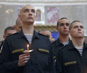 epa07693791 Orthodox priests, navy sailors and civilians attend a memorial service at Kronshtadt Navy Cathedral for fourteen sailors who died in the Barents Sea in Kronshtadt, outside St. Petersburg, Russia, 04 July 2019. Fourteen people died from suspected smoke poisoning aboard Losharik submarine vessel in the Barents Sea on 01 July.  EPA/ANATOLY MALTSEV