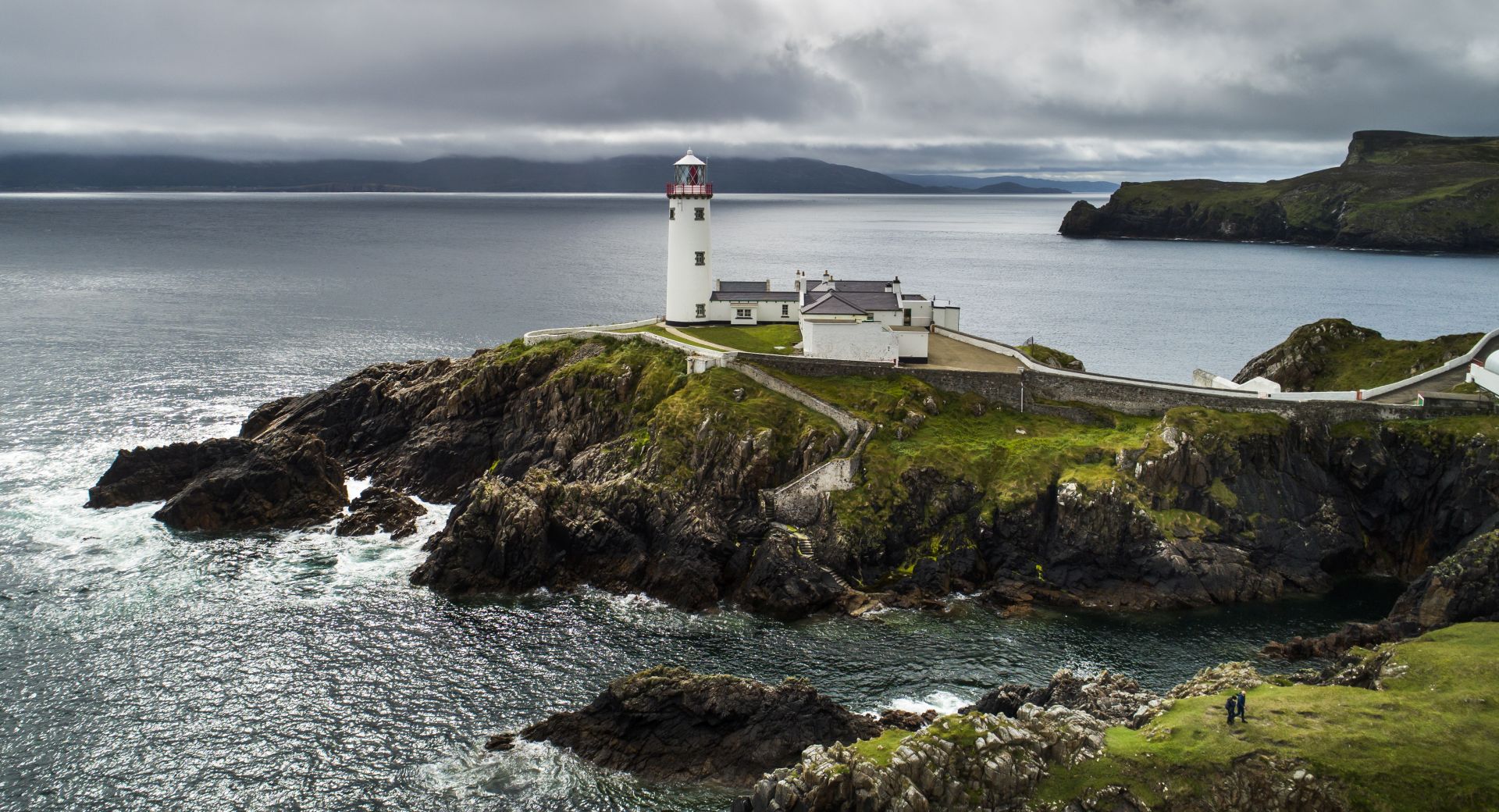 epa07699322 A picture take with a drone shows the 200-year-old Fanad Head Lighthouse on the northern coast of County Donegal, Ireland, 05 July 2019 (issued 06 July 2019). The lighthouse was built in 1817 following the shipwreck of the HMS Saldhana in nearby Lough Swilly, which caused all 253 passengers to lose their lives. Today, guests can overnight in the lighthouse, in quarters once used by lighthouse keepers.  EPA/JIM LO SCALZO