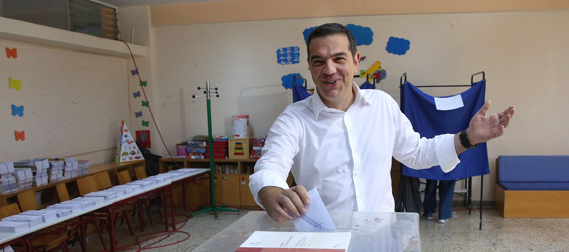 epa07700782 Greece's Prime Minister Alexis Tsipras casts his vote during the general elections at a polling station in Athens, Greece, 07 July 2019. Greek voters will go to the polls on 07 July 2019 to cast their ballots in the Greek general elections.  EPA/ORESTIS PANAGIOTOU