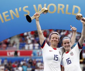 epa07701822 USA's Megan Rapinoe (L) and USA's Rose Lavelle (R) pose with the  trophy after the FIFA Women's World Cup 2019 final soccer match between USA and Netherlands in Lyon, France, 07 July 2019.  EPA/IAN LANGSDON