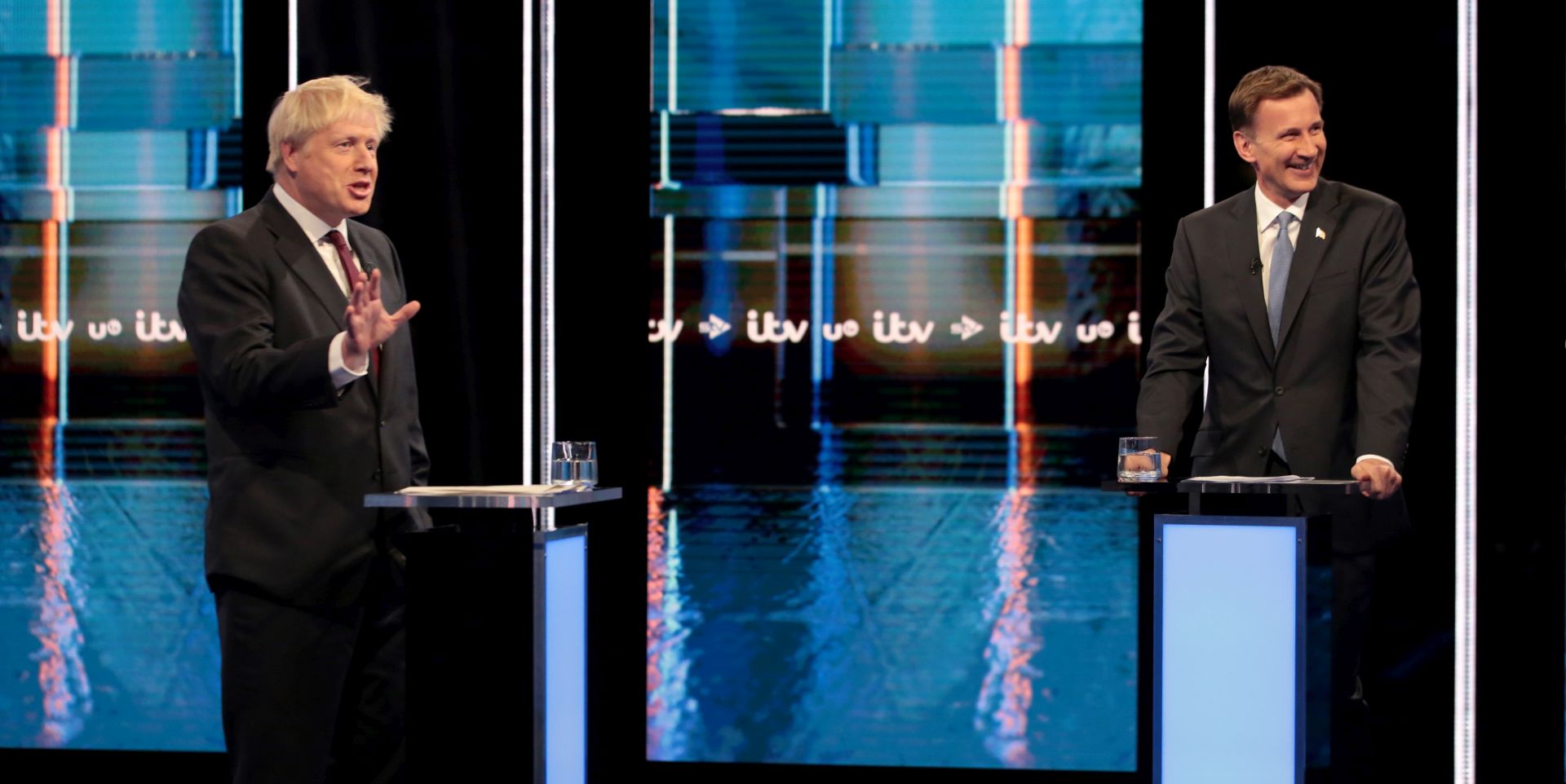 epa07706450 Jeremy Hunt, Secretary of State for Foreign Affairs, reacts as Boris Johnson, MP, speaks during the first televised head-to-head debate between Boris Johnson and Jeremy Hunt vying to become Britain's next Prime Minister in ITV Studios in Salford, Britain, 09 July 2019.  EPA/Matt Frost / ITV / HANDOUT 30 DAYS FREE  HANDOUT EDITORIAL USE ONLY/NO SALES HANDOUT EDITORIAL USE ONLY/NO SALES