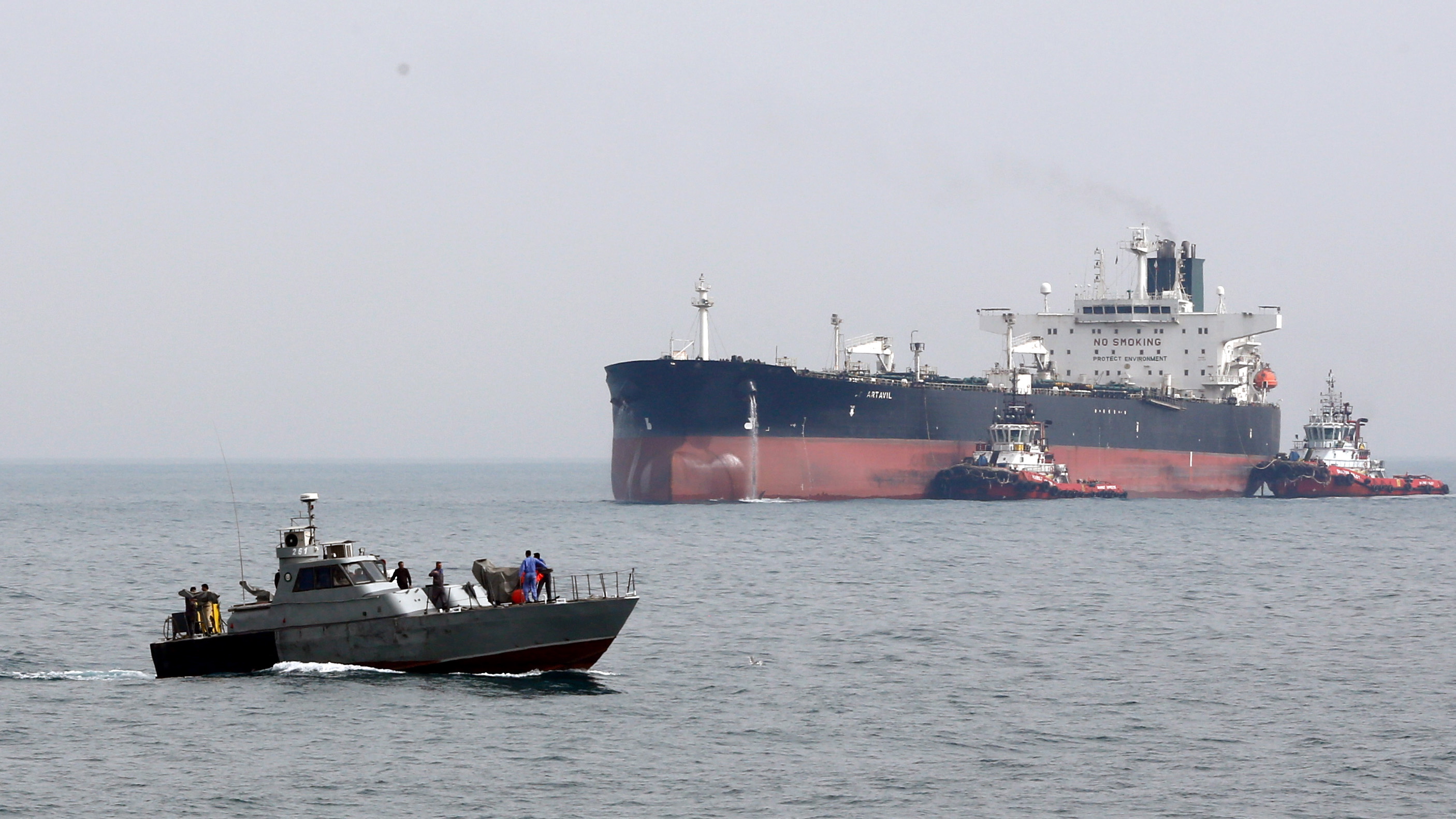 epa07709521 (FILE) - An Iranian military boat patrols next to the Artavil oil tanker, at the Kharg Island, in Persian Gulf, southern Iran, 12 March 2017 (reissued 11 July 2019). Reports on 11 July 2019 state British frigate HMS Montrose warned Iranian boats believed to belong to  Islamic Revolution Guard Corps (IRGC) of Iran that allegedly tried to impede the British Heritage tanker near the Gulf. HMS Montrose took position between the boats and the tanker while training its guns on the boats  reports state. The vessels then left the scene with no shots being fired on either side. Islamic Revolution Guard Corps (IRGC) has denied any involvement.  EPA/ABEDIN TAHERKENAREH
