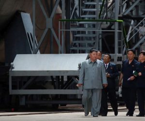 epa07734365 A photo released by the official North Korean Central News Agency (KCNA) on 23 July 2019 shows Kim Jong-Un (C), chairman of the Workers' Party of Korea, chairman of the State Affairs Commission of the Democratic People's Republic of Korea, and supreme commander of the armed forces of the DPRK, made a round of the newly-laid down submarine at an undisclosed location in North Korea.  EPA/KCNA   EDITORIAL USE ONLY