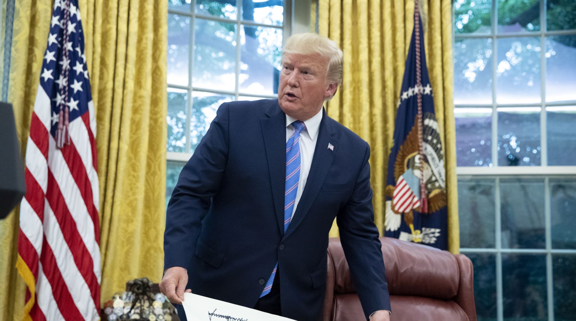 epa07736212 US President Donald J. Trump attends the ceremony of Mark Esper being sworn-in as US Secretary of Defense, in the Oval Office of the White House in Washington, DC, USA, 23 July 2019. Earlier on the same day, the Senate confirmed Mark Esper as Secretary of Defense.  EPA/MICHAEL REYNOLDS