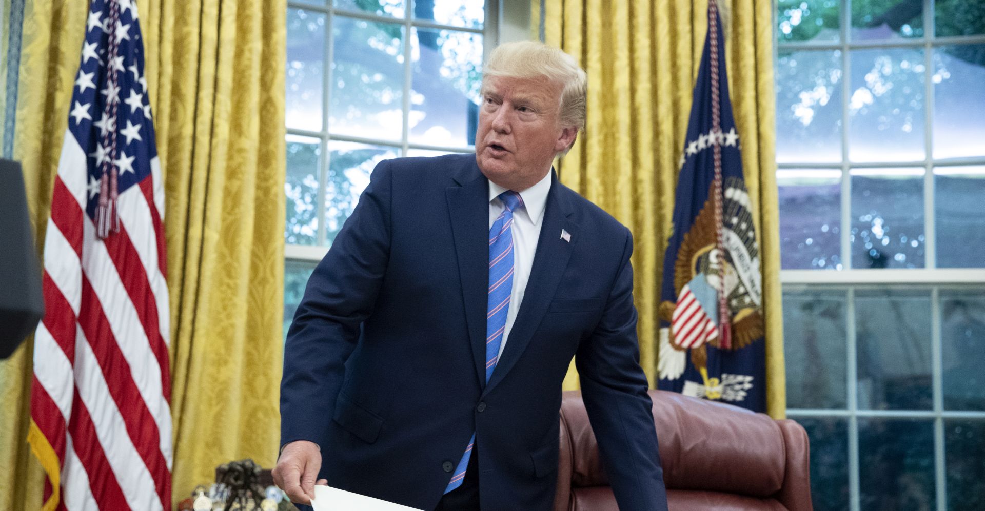 epa07736212 US President Donald J. Trump attends the ceremony of Mark Esper being sworn-in as US Secretary of Defense, in the Oval Office of the White House in Washington, DC, USA, 23 July 2019. Earlier on the same day, the Senate confirmed Mark Esper as Secretary of Defense.  EPA/MICHAEL REYNOLDS
