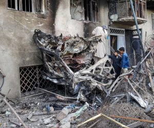 epa07747161 Children look at damaged buildings a day after a suicide attack followed by a gunfight against the office of Afghan former chief of intelligence and current candidate for first vice president of Ashraf Ghani, in Kabul, Afghanistan, 29 July 2019. According to reports, at least 20 people were killed and 50 others wounded in the incident which targeted the office of Amrullah Saleh.  EPA/HEDAYATULLAH AMID