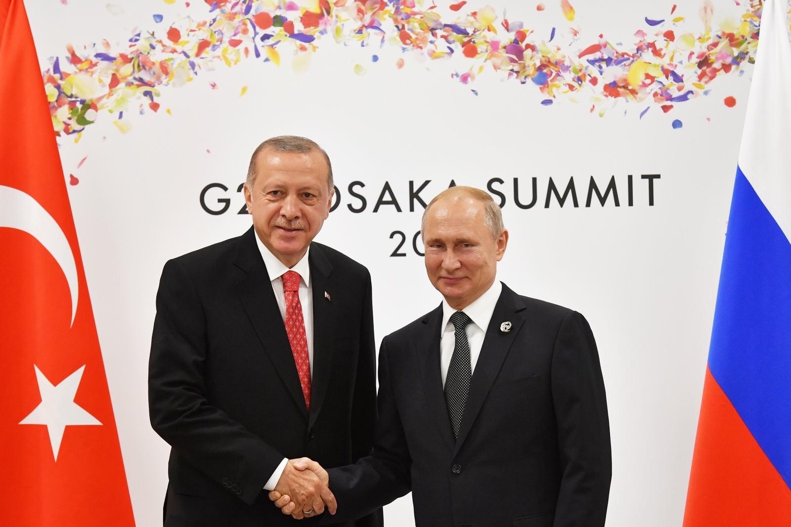 Russian President Putin and Turkish President Erdogan attend their bilateral meeting on the sidelines of the G20 leaders summit in Osaka Russian President Vladimir Putin (R) shakes hands with Turkish President Recep Tayyip Erdogan during their bilateral meeting on the sidelines of the G20 leaders summit in Osaka, Japan, on June 29, 2019. Yuri Kadobnov/Pool via REUTERS POOL