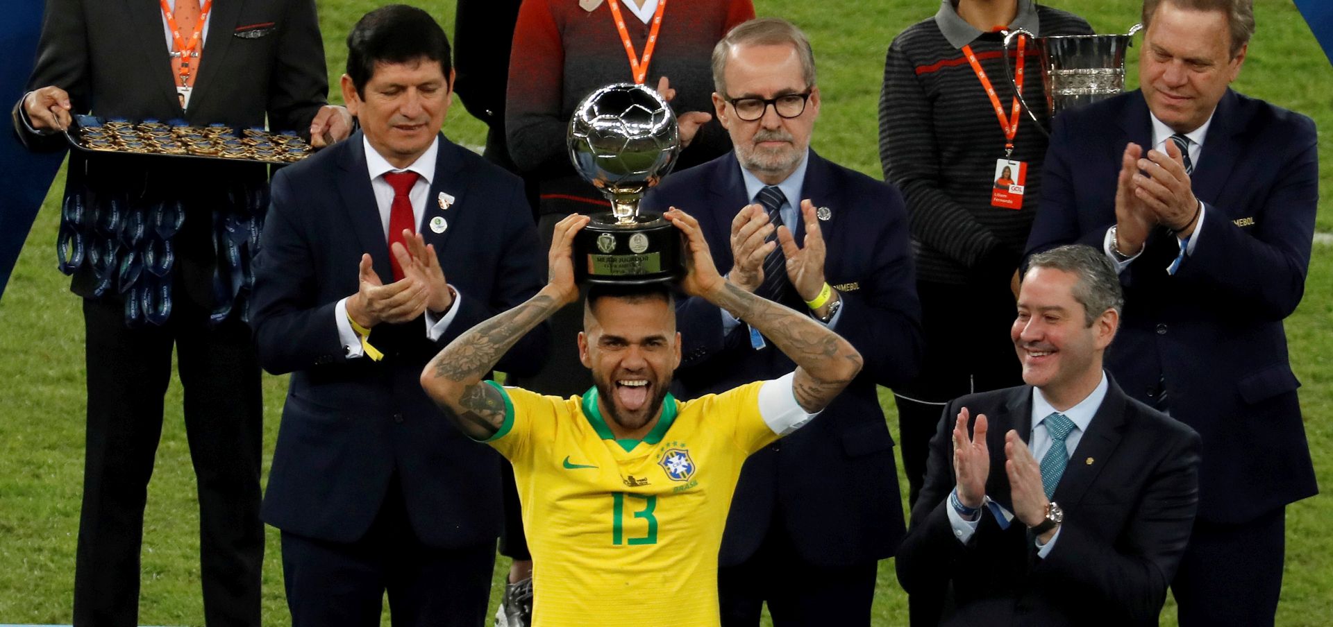 epaselect epa07702462 Brazil's Dani Alves holds the trophy after the Copa America 2019 final soccer match between Brazil and Peru, at Maracana Stadium in Rio de Janeiro, Brazil, 07 July 2019.  EPA/Paulo Whitaker