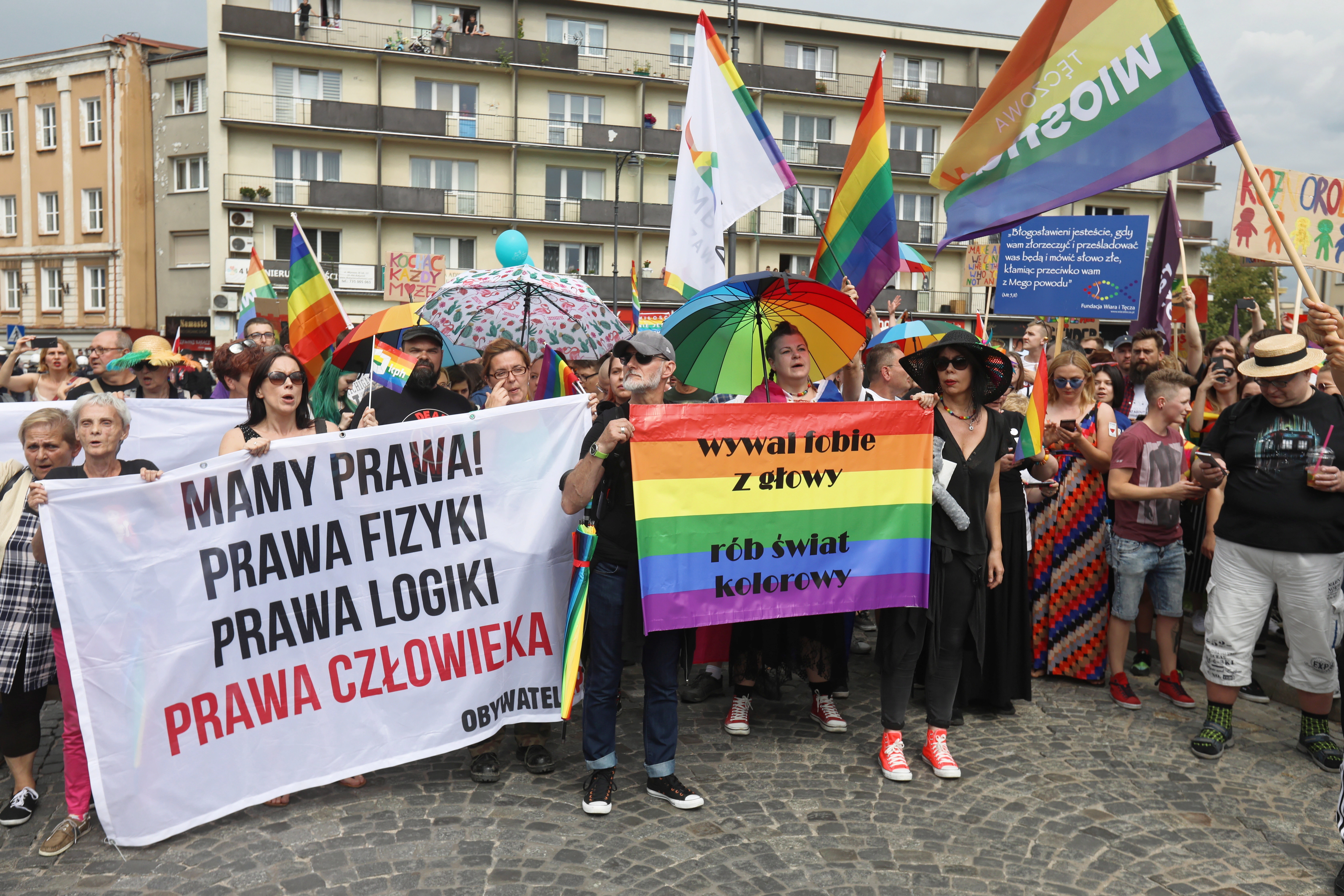 epa07731750 Participants with banners 'We have got Rights' The Laws of Physics, The laws of Logic, Human Rights' and 'Get rid of phobias, make colorful world' march in the First Equality March under the motto 'Bialystok is home for everybody' organized by the LGBT Association 'Teczowy Bialystok' in Bialystok, Poland, 20 July 2019 (issued 21 July 2019). According to reports, counter demonstrations of nationalists and far right supporters tried to block the first ever LGBTQ equality march in Bialystok throwing rocks, eggs and flash bombs into participants of equality march. Police have detained 25 people  EPA/ARTUR RESZKO POLAND OUT