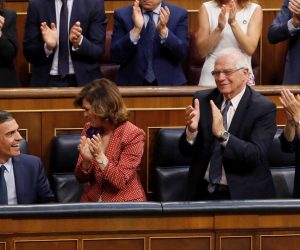 epa07739554 Spanish acting Prime Minister and aspirant for re-election Pedro Sanchez (L, front) smiles as acting Deputy Prime Minister Carmen Calvo (2-L, front); acting Foreign Affairs Minister, Josep Borrell (3-L, front), and his party's MPs applaud after he delivered a speech during the second and last investiture vote at Lower Chamber of Spanish Parliament in Madrid, Spain, 25 July 2019. Sanchez faces his re-election vote at Lower Chamber without enough support from other parties, as the socialists have no reached an agreement with left coalition Unidas Podemos (United, We Can) yet.  EPA/BALLESTEROS