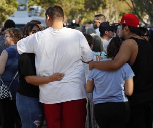 epa07748208 Residences of Gilroy and surrounding communities gather behind the Gilroy City Hall during a vigil for victims of the Gilroy Garlic Festival shooting in Gilroy, California, USA, 29 July 2019. A gunman opened fire on visitors at the garlic festival, killing at least three people and injuring 12 others. Police shot and killed one suspect, 19-year-old Santino William Legan.  EPA/JOHN G. MABANGLO