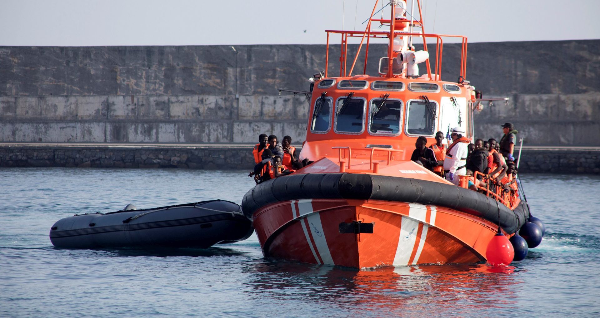 epa07753949 Some of the 46 migrants rescued by Spanish Salvamento Maritimo arrive at Motil's port in Granada, Andalusia, Spain, 02 August 2019. A total of 46 migrants were rescued near Alboran Island on board a small boat while trying to reach Spanish territory.  EPA/Miguel Paquet