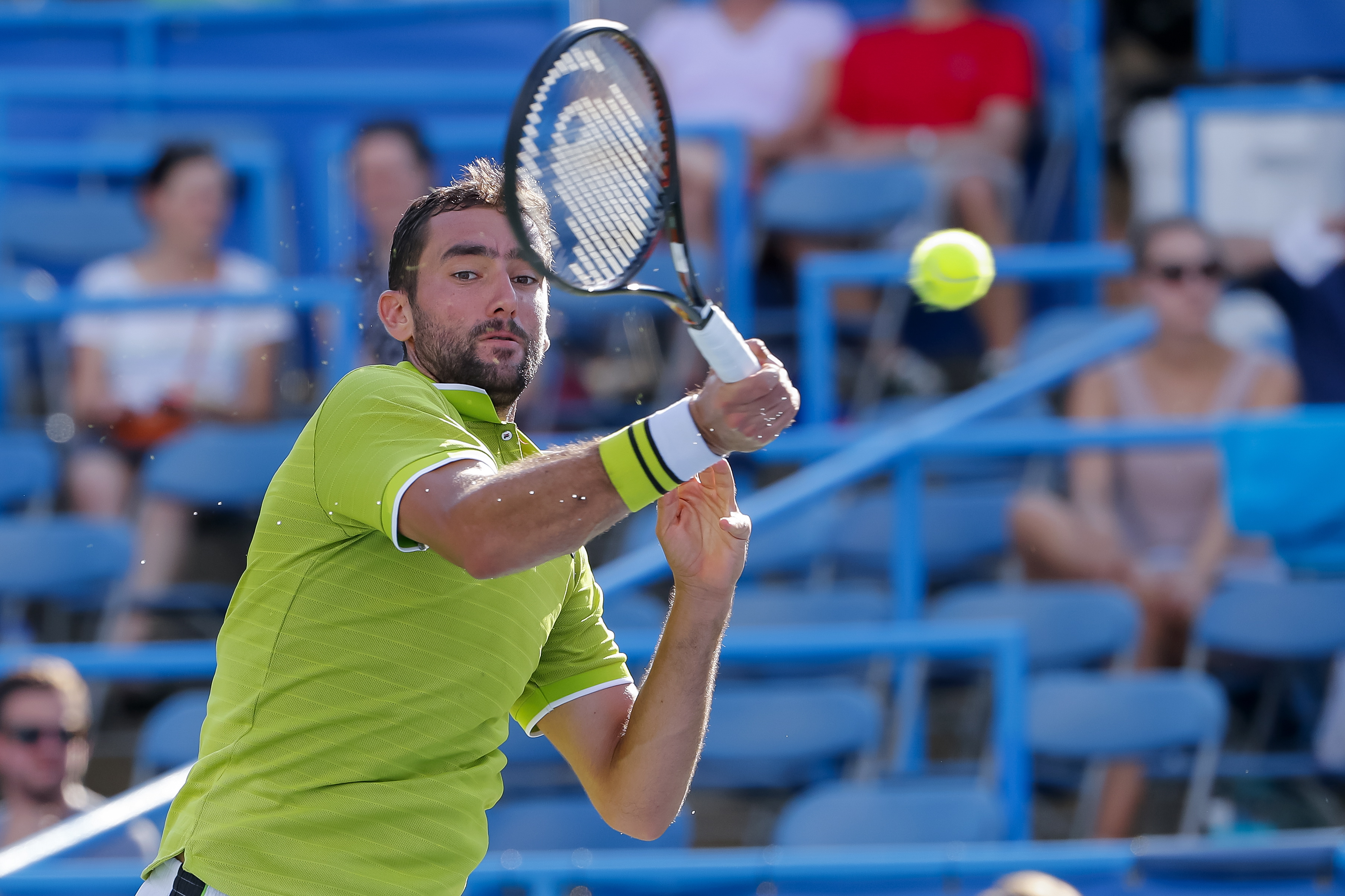 epa07754180 Marin Cilic of Croatia in action against Daniil Medvedev of Russia during a quarterfinal round match in the Citi Open tennis tournament at the Rock Creek Park Tennis Center in Washington, DC, USA, 02 August 2019.  EPA/ERIK S. LESSER