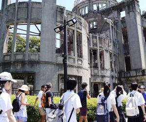 epa07757888 School students walk before the Atomic Bomb Dome at Hiroshima Peace Memorial Park in Hiroshima, western Japan, 05 August 2019. Hiroshima will mark 74th anniversary of the atomic bombing on 06 August 2019.  EPA/JIJI PRESS JAPAN OUT EDITORIAL USE ONLY/  NO ARCHIVES