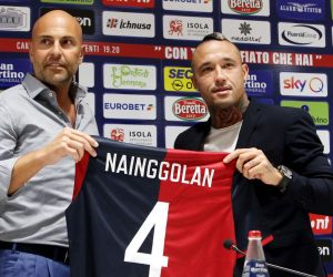 epa07758380 Cagliari Calcio's midfielder Radja Nainggolan (R) at Sardegna Arena stadium during his presentation, Cagliari, Italy, 05 August 2019. On the left Cagliari's president Tommaso Giulini.  EPA/FABIO MURRU