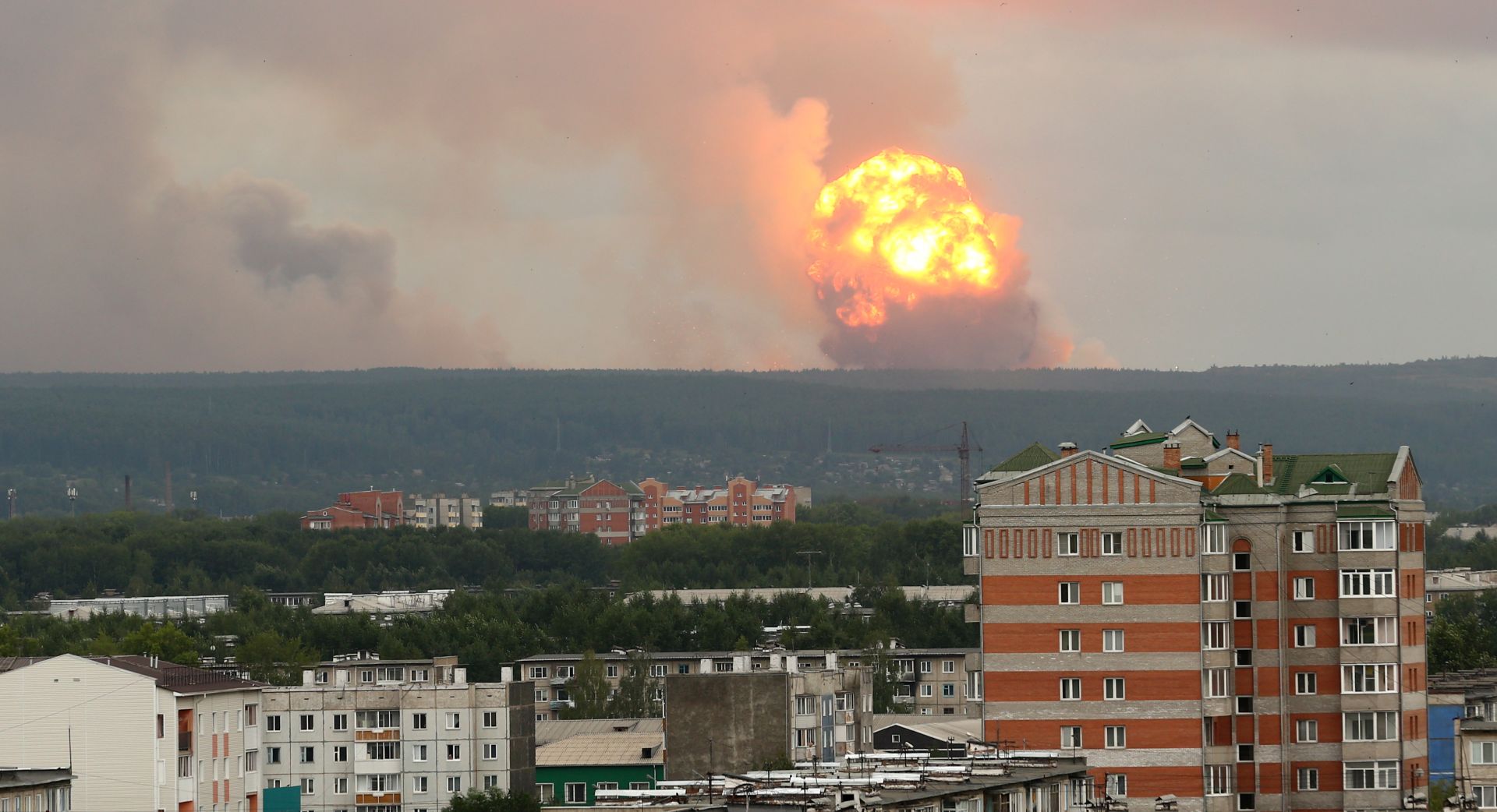 epa07758758 Explosions of a military ammunition depot some six miles away from a city of Achinsk, Krasnoyarsk area, 05 August 2019, issued 06 August 2019. Reports by the Emergenicies Ministry stating about 12 people were injured during the explosions.  EPA/DMITRY DUB