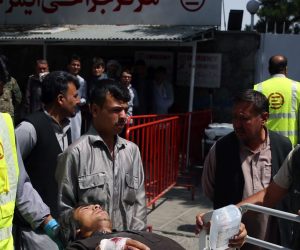 epa07759916 Afghan health workers transport a wounded man to a hospital after bomb explosion and gun fight that targeted a police station in a heavy residential area of Kabul, Afghanistan, 07 August 2019. According to reports, at least 95 people were wonded in the attack.  EPA/JAWAD JALALI