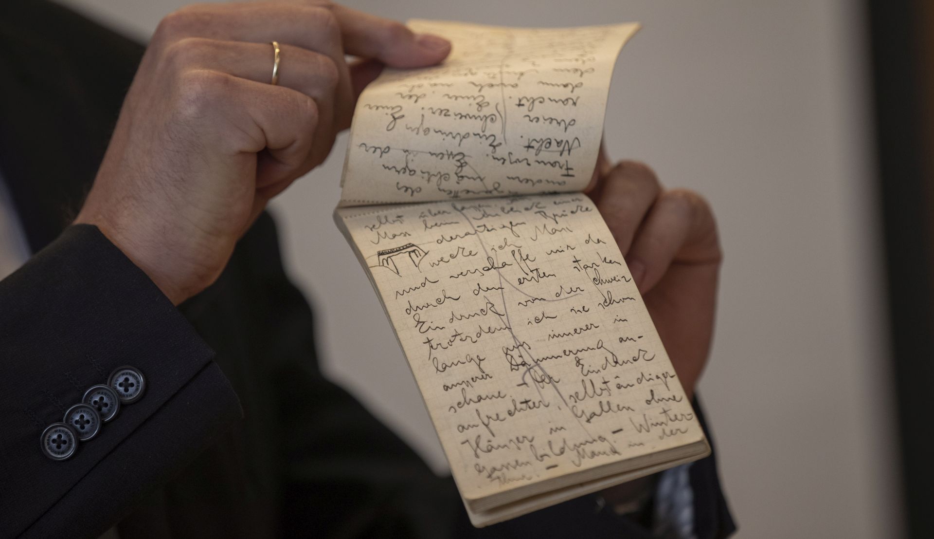 epa07760268 Israeli Stefan Litt (unseen), the NLI (The National Library of Israel) Humanities Collection curator and archivist responsible for the archive shows the Last Batch of Max Brod and Franz Kafka papers after decades in Swiss Vault, during a press conference at the National Library of Israel in Jerusalem, Israel, 07 August 2019. According to the NLI (The National Library of Israel): The Max Brod archive includes dozens of handwritten letters sent by Kafka to his friend Brod, including a number of postcards. letters, manuscripts, journals, notebooks, sketches and more , have been transferred to the National Library of Israel, following orders by Israeli and Swiss courts to open vaults in Zurich, which had stored the materials for decades.  EPA/ATEF SAFADI