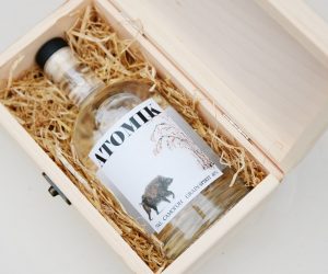 epa07770047 An undated handout photo made available by the University of Portsmouth on 12 August 2019 shows the a bottle of ATOMIK vodka lying in a packaging (issued 12 August 2019). A group of Ukrainian and UK scientists have produced a high quality artisan vodka ('moonshine') calling it ATOMIK grain spirit from grain and water from the abandoned region. According to Professor Jim Smith of the University of Portsmouth, the vodka is safe to drink and free of radioactivity. It is not on sale - yet.  EPA/PORTSMOUTH UNIVERSITY / HANDOUT MANDATORY CREDIT: UNIVERSITY OF PORTSMOUTH HANDOUT EDITORIAL USE ONLY/NO SALES