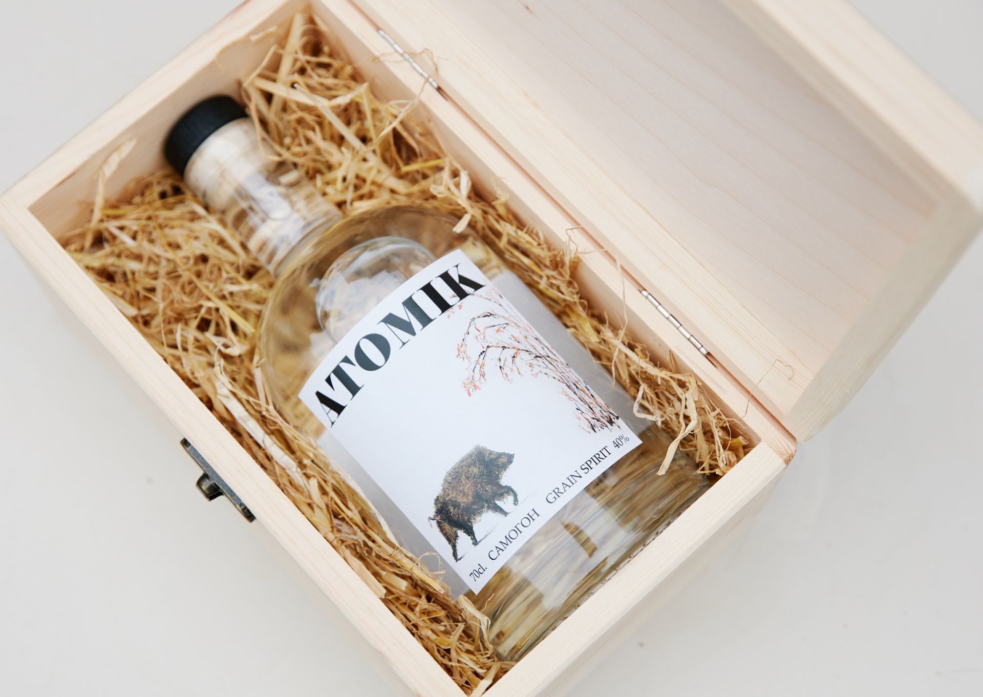 epa07770047 An undated handout photo made available by the University of Portsmouth on 12 August 2019 shows the a bottle of ATOMIK vodka lying in a packaging (issued 12 August 2019). A group of Ukrainian and UK scientists have produced a high quality artisan vodka ('moonshine') calling it ATOMIK grain spirit from grain and water from the abandoned region. According to Professor Jim Smith of the University of Portsmouth, the vodka is safe to drink and free of radioactivity. It is not on sale - yet.  EPA/PORTSMOUTH UNIVERSITY / HANDOUT MANDATORY CREDIT: UNIVERSITY OF PORTSMOUTH HANDOUT EDITORIAL USE ONLY/NO SALES