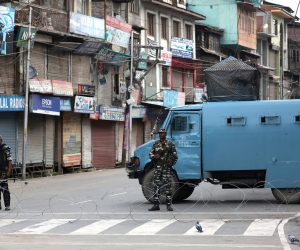 epa07770330 Indian paramilitary soldiers stand guard near barbed wire set up as temporary barricade during restriction in Srinagar, India,12 August 2019. The Indian government on 05 August moved a resolution in the parliament that removes the special constitutional status granted to the disputed Kashmir region. The Indian-administered Kashmir region has been under heavy lockdown since then. Kashmir has been a disputed region since 1947 when India and Pakistan won their freedom from British rule.  EPA/FAROOQ KHAN
