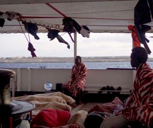 epa07774342 An undated handout photo made available by Spanish NGO Proactiva Open Arms shows several migrant resting in the deck of the Spanish NGO Open Arms' ship at sea in the Mediterranean (issued 15 August 2019). The 147 migrants, on board the ship, reached Italian waters off Lampedusa island a day after the Lazio Regional Administrative Court accepted its appeal, suspending the ban on entry into Italian waters ordered by Italian Interior Minister Matteo Salvini. The ship has been waiting to get into a port since last 01 August.  EPA/FRANCISCO GENTICO/OPEN ARMS HANDOUT -- BEST QUALITY AVAILABLE -- HANDOUT EDITORIAL USE ONLY/NO SALES