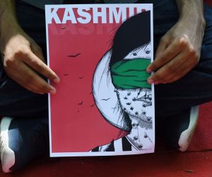 epa07764113 An activist holds a placard as he takes part in a demonstration to condemn the scrapping of Article 370 that granted a special status to Jammu and Kashmir, by the Indian government, in New Delhi, India, 09 August 2019. Indian government on 05 August moved a resolution in the parliament that removes the special constitutional status granted to the disputed Kashmir region. The Indian-administered Kashmir region has been under heavy lockdown with a restriction on public gatherings. Kashmir has been a disputed region since 1947 when India and Pakistan won their freedom from British rule.  EPA/STR