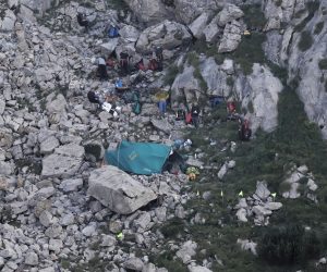 epa07781953 Polish TOPR (Voluntary Tatra Rescue Service) rescuers at the entrance to the 'Wielka Sniezna' Cave on the fourth day of the rescue operation in Zakopane, Poland, 20 August 2019. TOPR rescuers take part in ongoing rescue operation of cavers trapped in the Wielka Sniezna cave, the longest and deepest cave in Tatra Mountains. Two cavers have been trapped since Saturday 17 August after a narrow tunnel was flooded and blocked their exit. According to reports, rescuers are using explosives to get to trapped cavers.  EPA/GRZEGORZ MOMOT POLAND OUT