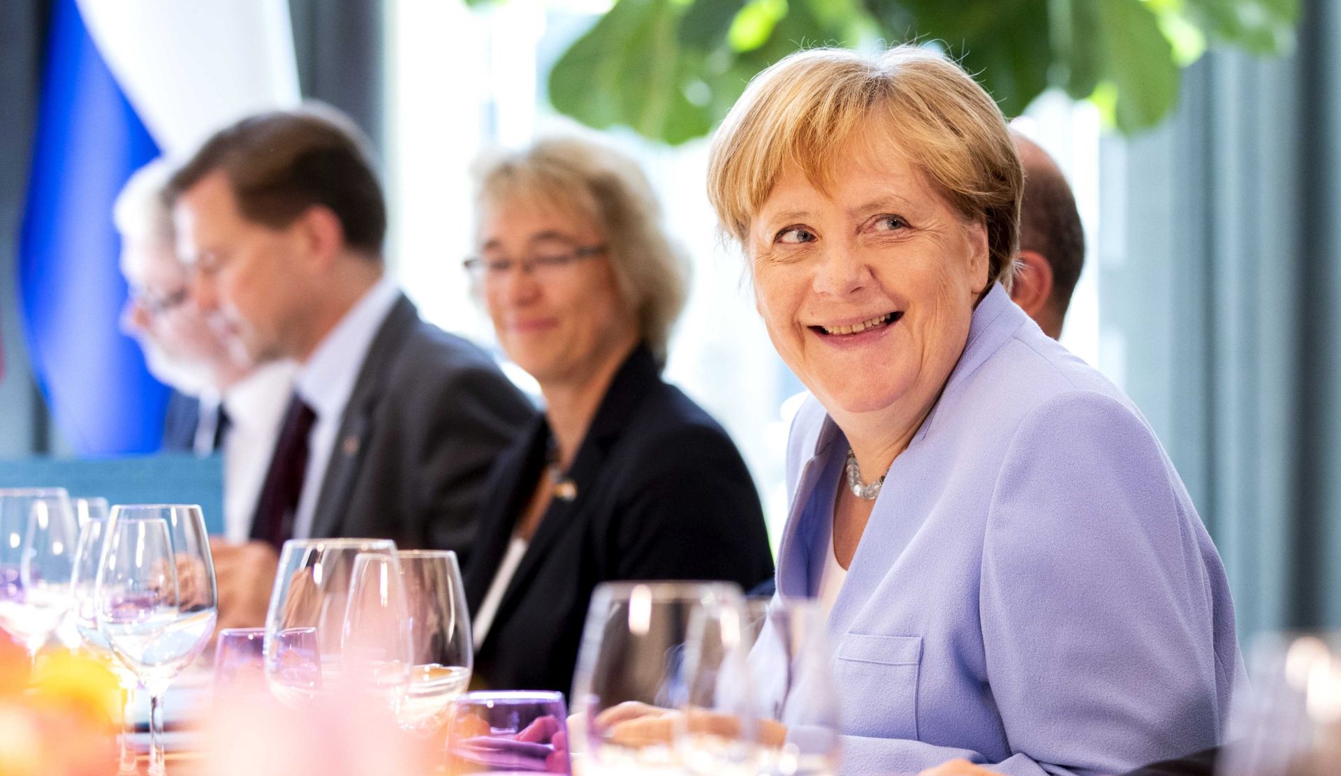 epa07785478 German Chancellor Angela Merkel (R), during a working lunch at the Catshuis on climate change in The Hague, The Netherlands, 22 August 2019.  EPA/REMKO DE WAAL