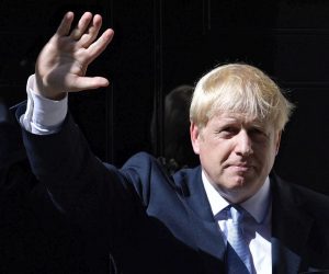 epa07798938 (FILE) - British Prime Minister Boris Johnson waves as he enters 10 Downing Street following his appointment by the Queen in London, Britain, 24 July 2019 (re-issued 28 August 2019). According to reports, British government has formally requested the intervention of the Queen in a bid to suspend parliament. A government source said the government's intention is to suspend parliament and hold a Queen's speech 14 October, setting out the future plans of a post-Brexit government.  EPA/NEIL HALL