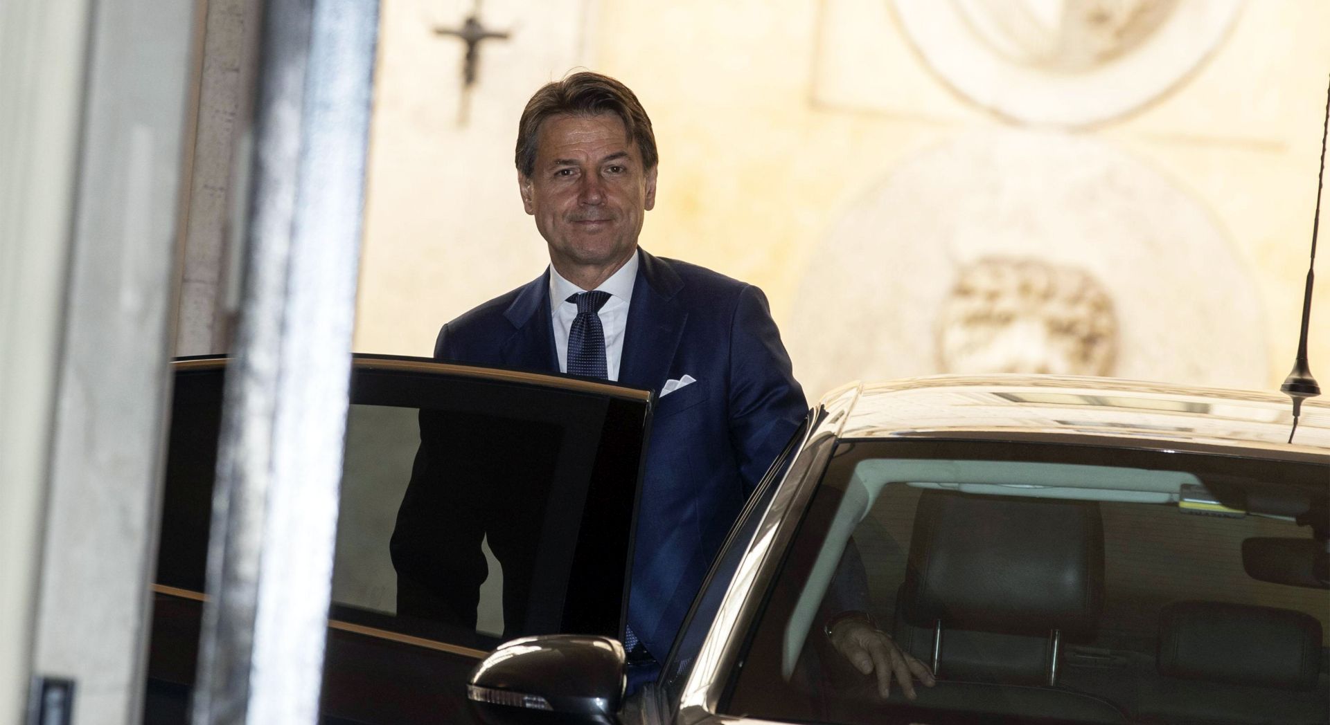 epa07800886 Designated Italian Prime Minister Giuseppe Conte leaves the Senate to go to the Chamber of Deputies, Rome, Italy, 29 August 2019. Sergio Mattarella handed outgoing Premier Giuseppe Conte a mandate to form a government. Conte, as is the usual practice, reserved the right to accept the mandate pending talks with the two parties supporting the government bid, the anti-establishment 5-Star Movement (M5S) and the centre-left Democratic Party (PD).  EPA/MASSIMO PERCOSSI