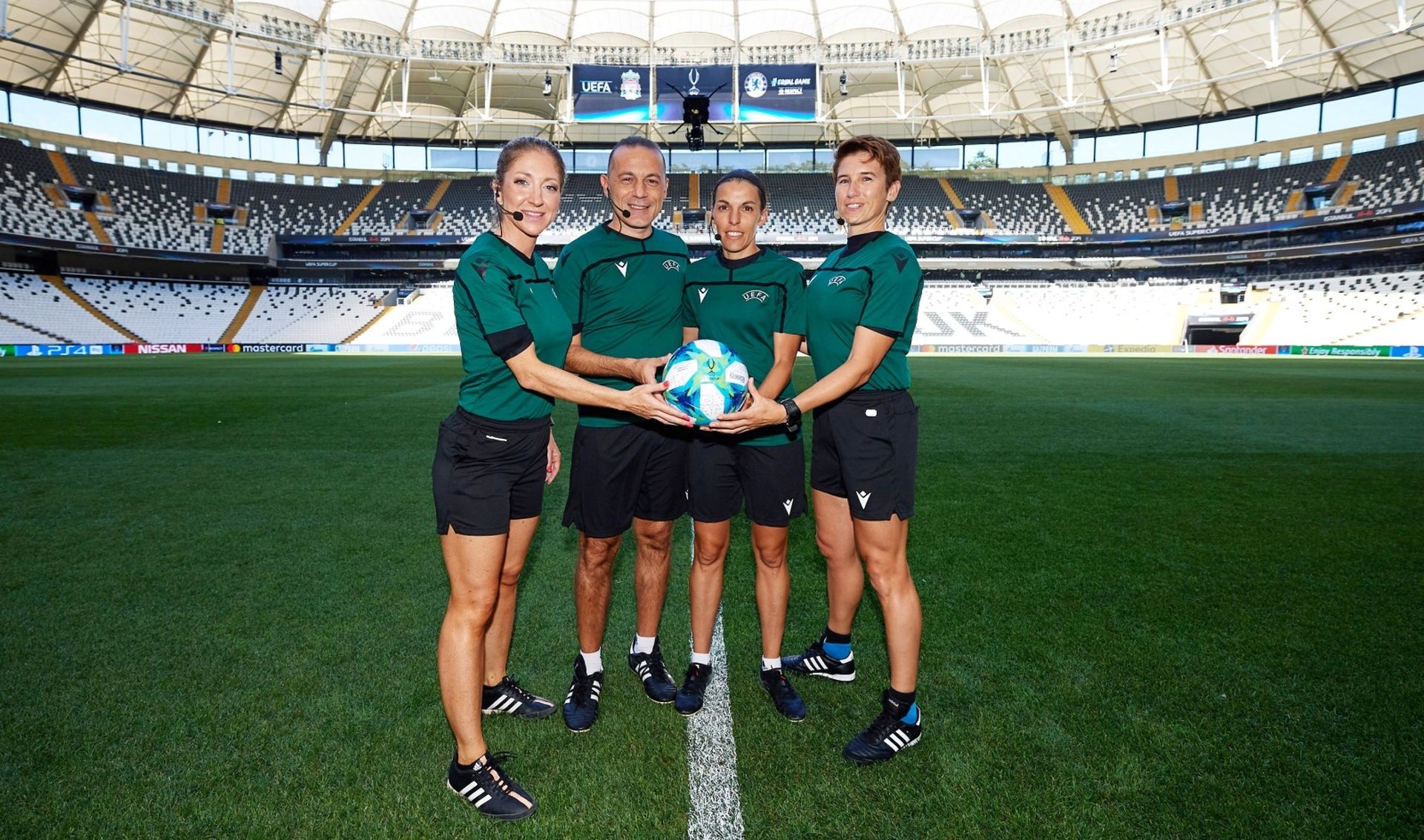 UEFA Super Cup - Match Officials Press Conference Soccer Football - UEFA Super Cup - Match Officials Press Conference - Vodafone Park, Istanbul, Turkey - August 13, 2019  (L-R) Assistant referee Manuela Nicolosi, fourth official Cuneyt Cakir, referee Stephanie Frappart and assistant referee Michelle O'Neill pose after the press conference  UEFA/Pool via REUTERS POOL