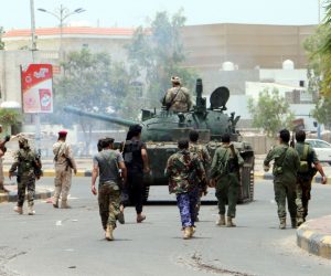 epa07766728 Armed members of a separatist southern group patrol a street during clashes with government forces in the southern port city of Aden, Yemen, 10 August 2019. According to reports, separatist forces in southern Yemen, backed by the United Arab Emirates, have seized all military bases belonging to the Saudi-backed Yemeni government in the southern city of Aden after four days of fighting between the two sides.  EPA/NAJEEB ALMAHBOOBI