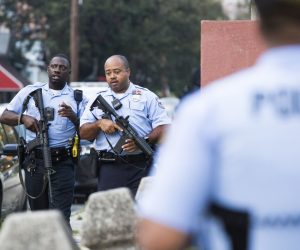epaselect epa07773958 Police with automatic rifles walk away from the intersection of 15th Street and W Erie Avenue during an active police shooting in Philadelphia, Pennsylvania, USA, 14 August 2019. A suspect shot at least five Philadelphia police officers, with gunfire continuing for more than one hour. One suspect is in custody and a second suspect is under SWAT surveillance in a house near the intersection of 15th Street and W Erie Ave.  EPA/STRINGER