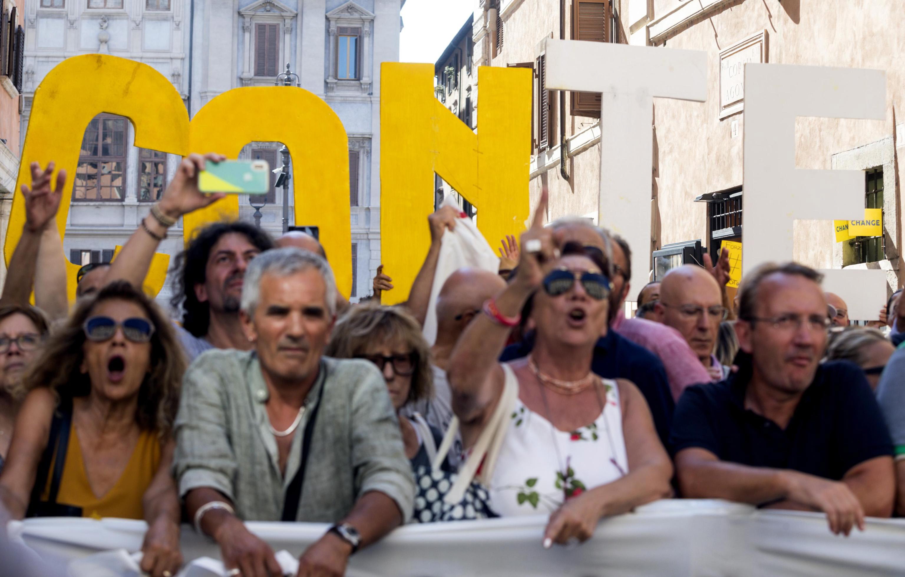 epa07782463 Supporters of the Five Star Movement (M5S) rally outside the Senate where Italian Premier Conte is addressing the Parliament in Rome, Italy, 20 August 2019. Italian Prime Minister Conte in his address says the government has stopped, and League leader Salvini was 'irresponsible and opportunist' and showed a 'grave lack of constitutional culture' in triggering a government crisis.  EPA/ANGELO CARCONI