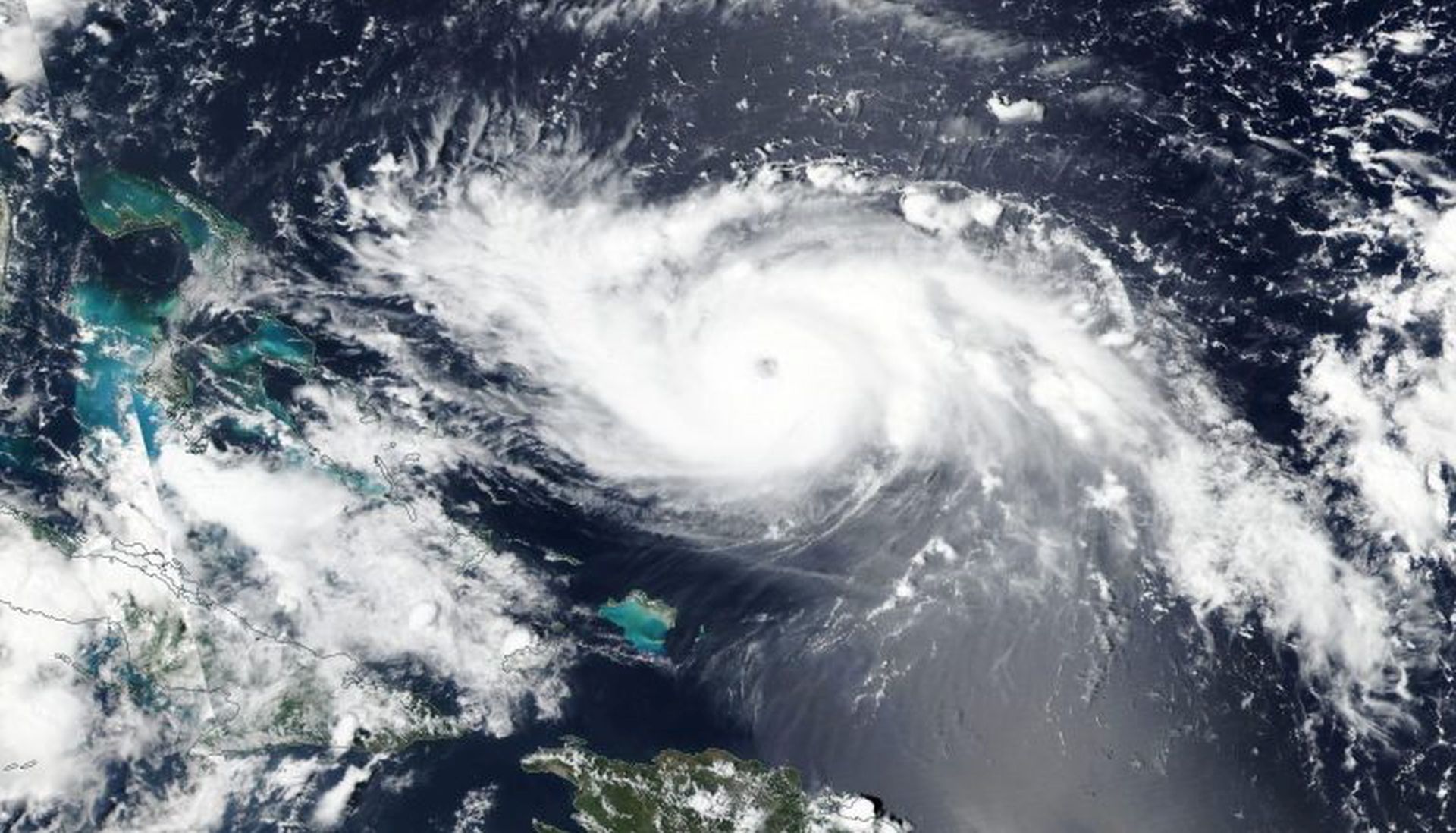 epa07807934 A handout photo made available by NASA showing NOAA-NASA’s Suomi NPP satellite visible light image of Hurricane Dorian on 30 August 2019, issued 31 August 2019 as it was just north of Turks and Caicos and heading towards the northwestern Bahamas. NASA report that  Dorian attained Category 4 status on the Saffir-Simpson Hurricane Wind Scale which means the storm is packing 130 – 156 mph (209-251 km/h) winds.  The second change in the storm was the turn it took during the nighttime hours which now has the storm potentially not making direct landfall on Florida but rather Georgia and the Carolinas.  EPA/NASA / HANDOUT MANDATORY CREDIT:  NASA Worldview, Earth Observing System Data and Information System (EOSDIS) HANDOUT EDITORIAL USE ONLY/NO SALES