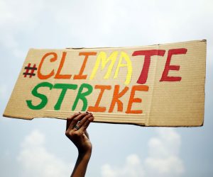 epa07855498 Bangladeshi school and college students hold a placard during the global climate change strike in Dhaka, Bangladesh, 20 September 2019. According to the Save the Children in Bangladesh and Green Savers Association they supported this strike as children and youth staged a protest in Dhaka to urge global leaders to act against climate change.  EPA/MONIRUL ALAM
