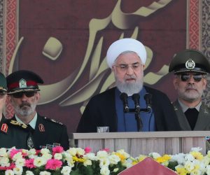 epa07860405 A handout photo made available by the Iranian presidential office shows Iranian President Hassan Rouhani (C) delivering his speech during the annual military parade marking the Iraqi invasion in 1980, which led to an eight-year-long war (1980-1988), as Iranian Islamic Revolutionary Guard Corps military commander General Mohammad Bagheri (L) looks on, in Tehran, Iran, 22 September 2019. Media reported that Rouhani said that he would present a cooperation plan for peace in the region during the UN summit in New York.  EPA/Iranian President Office HANDOUT  HANDOUT EDITORIAL USE ONLY/NO SALES