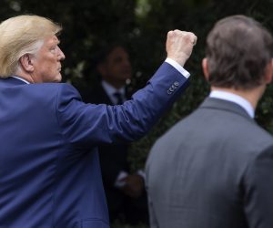 epa07872412 US President Donald J. Trump reacts after receiving a plaque for his efforts to stop illegal immigration from a group of US sheriffs at the South Portico of the White House in Washington, DC, USA, 26 September 2019.  EPA/ERIK S. LESSER