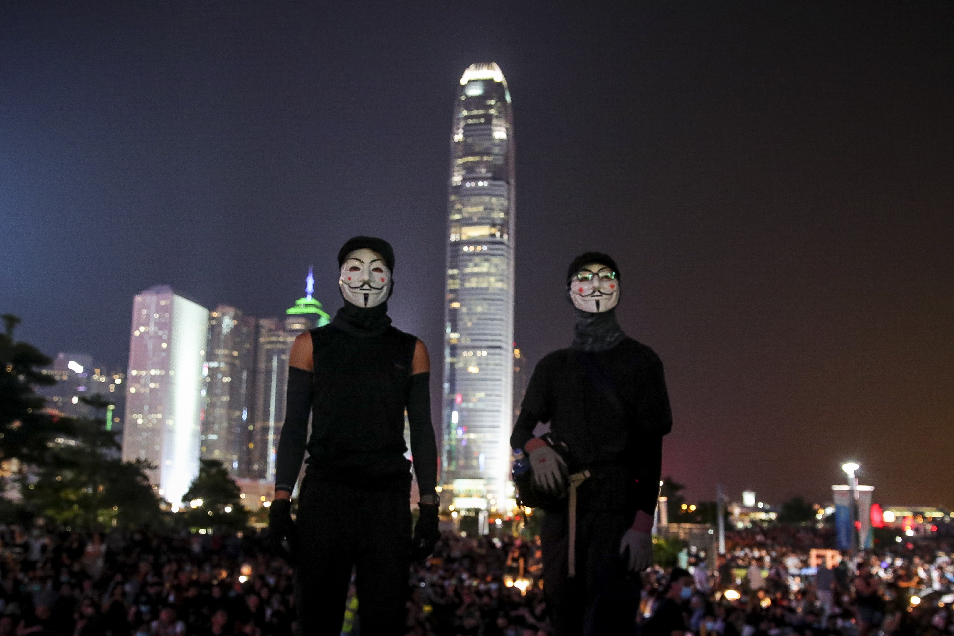 epa07876222 Anti-government protesters wearing Guy Fawkes masks take part in a flash mob commemorating the 5th anniversary of the 'Umbrella Revolution' in Hong Kong, China, 28 Sept. 2019. In 2014 the series and sit-ins and protests, nicknamed the Umbrella Revolution or Umbrella Movement, began after China's Standing Committee of the National People's Congress issued a decision regarding proposed reforms to the Hong Kong electoral system. Hong Kong has entered its fourth month of mass protests, originally triggered by a now suspended extradition bill to mainland China that have turned into a wider pro-democracy movement.  EPA/FAZRY ISMAIL