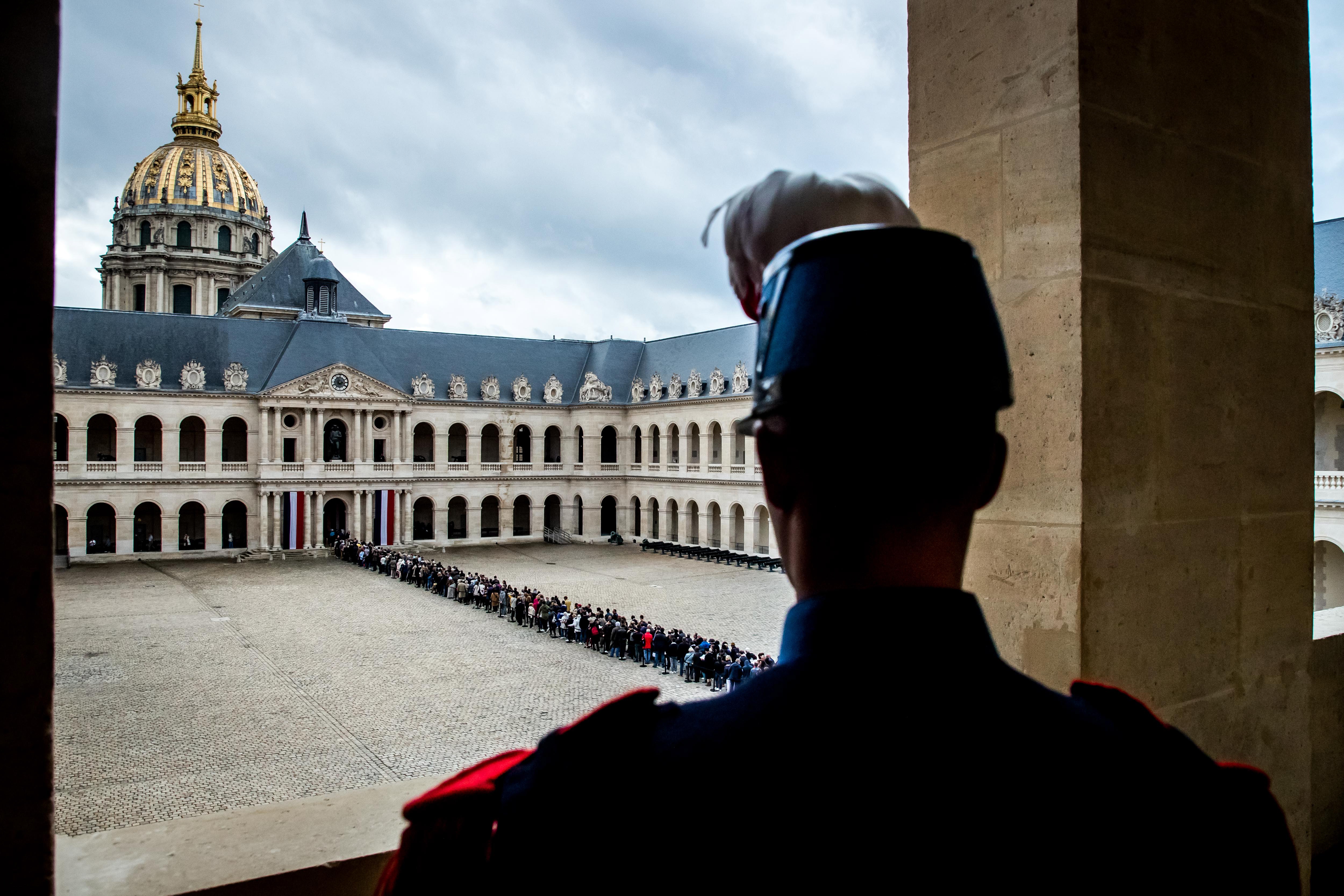 epa07879653 A French army Cadet looks at the people queuing to pay tribute to the late former French President Jacques Chirac at the National Invalides Hotel where his coffin is displayed for a public tribute, following his death in Paris, France, 29 September 2019. The former French president Jacques Chirac died on 26 September in Paris, aged 86. Chirac's health was troubled ever since a 2005 stroke he suffered while still in office. He was head of state from 1995 to 2007, was twice president, twice prime minister and 18 years mayor of Paris.  EPA/CHRISTOPHE PETIT TESSON