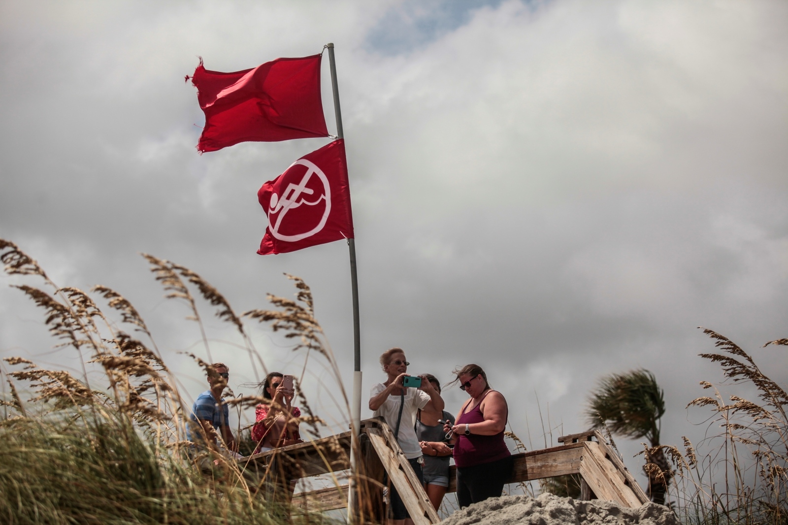 Locals and tourist watch the waves by Jacksonville Beach ahead of Hurricane Dorian in Jacksonville Locals and tourist watch the waves by Jacksonville Beach ahead of Hurricane Dorian in Jacksonville, Florida, U.S. September 3, 2019. REUTERS/Maria Alejandra Cardona MARIA ALEJANDRA CARDONA