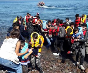 epaselect epa07886412 Migrants from Afghanistan arrive on a dinghy on the coast of Skala Sikamias, on the island of Lesvos, Greece, 01 October 2019.  EPA/STRATIS BALASKAS