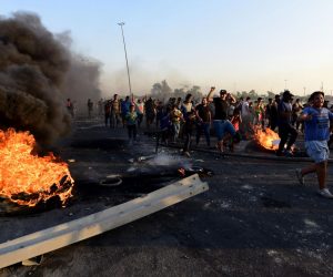 epa07892775 Iraqis protest in east Baghdad, Iraq, 03 October 2019. According to local media reports at least 27 people have died since protests erupted two days earlier. Despite an unlimited curfew that was declared in Baghdad on 03 October from 5 am, the protesters went out again and shouted slogans against the government demanding better services and jobs.  EPA/MURTAJA LATEEF